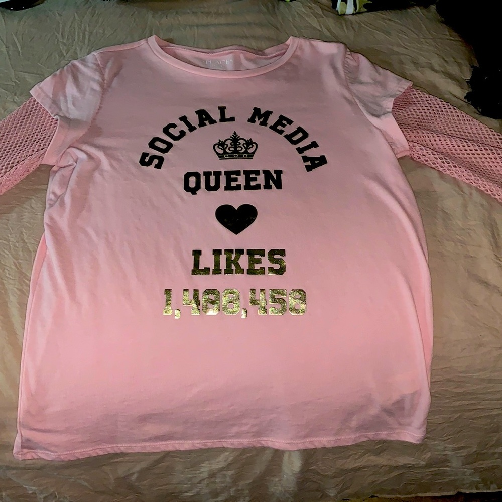 Light pink graphic tee with mesh sleeves